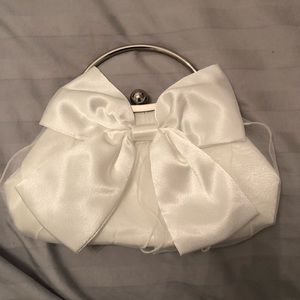 White satin clutch purse with bow
